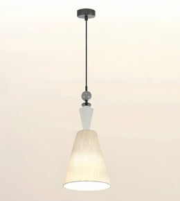 A modern pendant light fixture with a black metal rod, a white geometric accent, and a textured cream-colored fabric shade, shown against a plain off-white background.