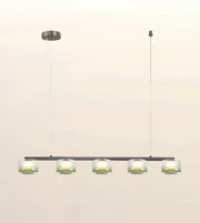 A modern 5-light linear pendant chandelier with frosted glass shades, suspended from a slim black horizontal bar with a matching round ceiling canopy and cord against a plain light background.