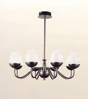 A 5-light chandelier with a dark bronze metal frame and textured white glass shades, shown against a plain beige background.
