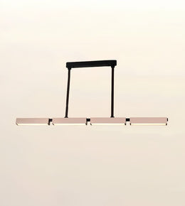 A modern linear LED pendant light with a matte black frame and horizontal bar, suspended against a plain off-white background.
