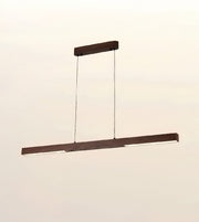 A modern linear LED pendant light with a dark brown wood-grain finish, suspended by two thin cables from a matching horizontal ceiling canopy against a plain off-white background.
