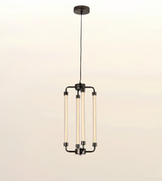 A modern multi-light linear pendant chandelier with four vertical frosted glass tubes and a dark metal frame, suspended from a circular ceiling canopy against a light beige background.
