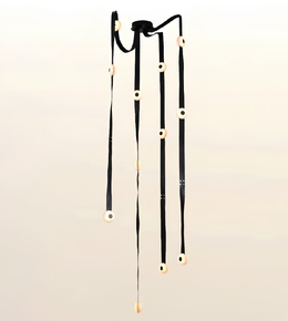 Contemporary cascade LED strap chandelier with illuminated circular light modules for staircases, foyers, double-height living rooms, and luxury interiors.