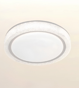 A modern circular flush-mount ceiling light fixture with a textured clear glass outer ring and a frosted white center, shown against a plain off-white background.