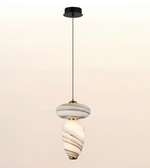 Modern marble-effect glass pendant light with sculptural double-form design, brushed brass accents, and warm ambient illumination.