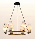 A modern six-light chandelier with a circular brass ring, black suspension rods, and textured white marble shades, shown against a plain light background.