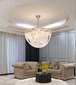 Luxurious living room with a chandelier, sofa, and coffee table.
