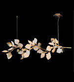 Nature-inspired branch chandelier featuring illuminated decorative leaves