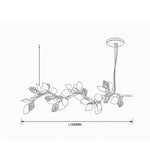 Nature-inspired branch chandelier featuring illuminated decorative leaves