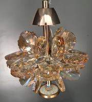 Gold pendant light fixture hanging from a ceiling