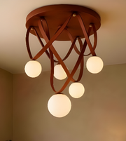 Ceiling light fixture with wooden design and multiple round lights on a neutral background