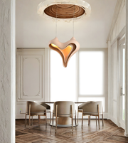 Modern dining room with a unique pendant light fixture.