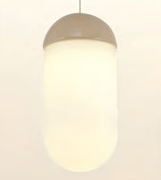 A modern cylindrical pendant light with a frosted white glass shade and a metallic taupe-gray dome-shaped top, shown against a plain off-white background.