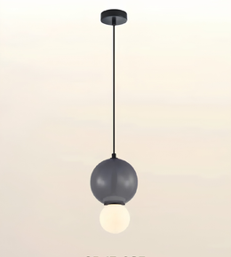 A modern pendant light fixture with a matte black ceiling canopy and cord, featuring a large dark gray spherical shade and a smaller glowing white globe bulb underneath, shown against a plain light background.
