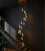 Luxury staircase chandelier with cascading crystal pendants.