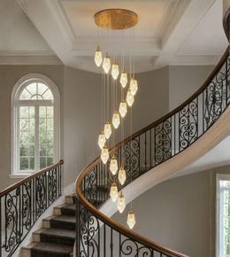 Cascading crystal chandelier for double-height staircase with gold finish