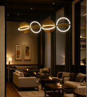 Modern interlinked ring LED pendant light in a luxury lounge interior