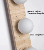 White glass lampshade on a natural yellow travertine surface with text labels.