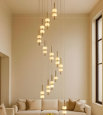 Modern living room with a chandelier and beige sofa.