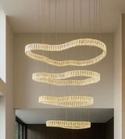 Modern chandelier with multiple circular rings hanging from the ceiling.
