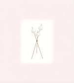 Minimalist gold tripod floor lamp with triple opal glass globes on white background