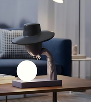 Daya Worldwide Mystique Gent Sculptural Table Lamp featuring an elegant statue design in a sleek, modern style.