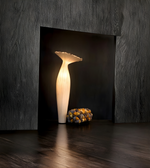 Modern statement floor lamp illuminated in contemporary interior