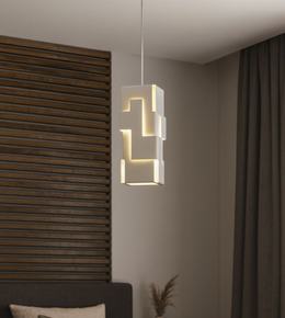 Modern geometric column pendant light with warm glow hanging beside bed in contemporary bedroom