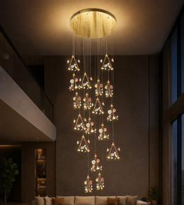 Luxury multi-tier floral cascade chandelier hanging in double height living room with warm ambient lighting