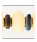 Close-up of a gold and blue beaded bracelet on a white background