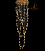 Luxury chandelier with floral designs on a black background, branded 'Dubai Lights'.