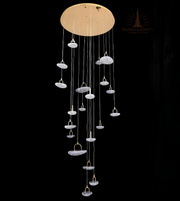 Modern chandelier with multiple hanging lights on a black background