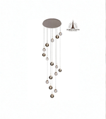 Modern pendant light with hanging spherical elements on a white background, branded 'Dubai Lights'.