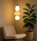Daya Worldwide ORBLINE pendant light hanging with a sleek spherical design, perfect for modern interior lighting.