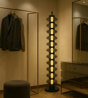 Modern Daya Worldwide Lumina Tower floor lamp with sleek design and warm lighting, standing tall as a stylish home decor piece.