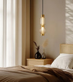 Stylish NOIR Ripple pendant light hanging from ceiling, featuring a modern ripple design by Daya Worldwide.